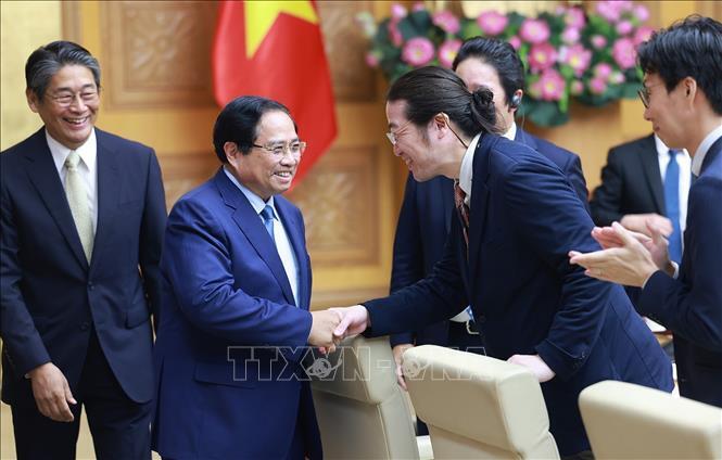 Thủ tướng Phạm Minh Chính với các doanh nghiệp Nhật Bản đang đầu tư tại Việt Nam. Ảnh: Dương Giang/TTXVN